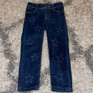 Dark denim skinny jeans with stars all over